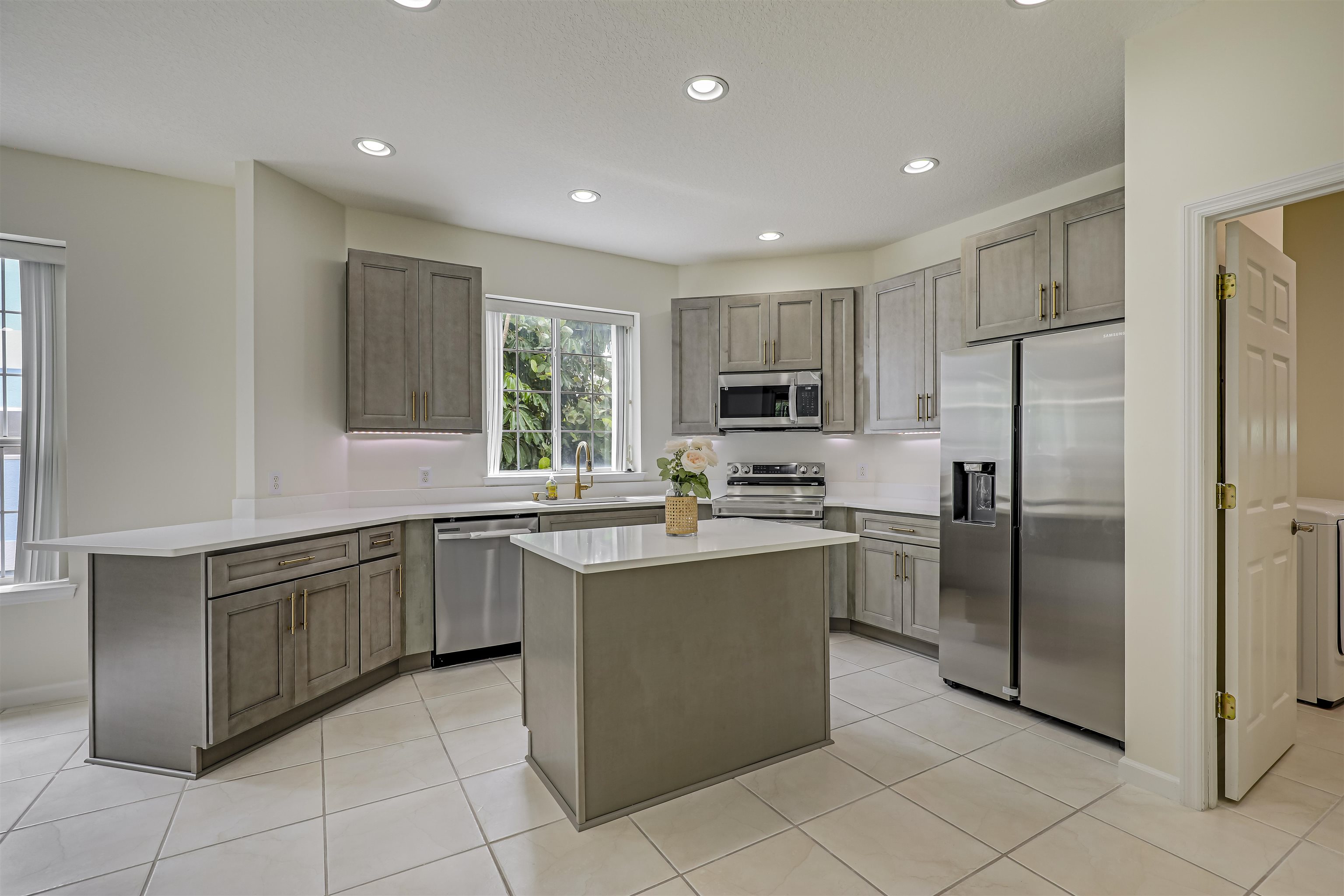9162 August Circle St. Augustine, FL 32080 - Photo 25 of 81 a kitchen with stainless steel appliances granite countertop a refrigerator and a sink