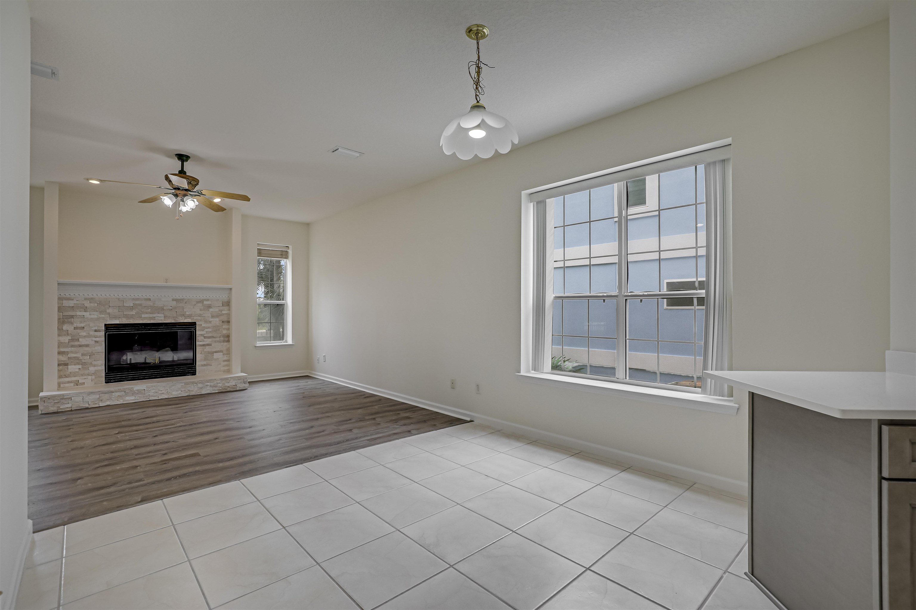 9162 August Circle St. Augustine, FL 32080 - Photo 28 of 81 a view of an empty room with exposed radiator and fireplace