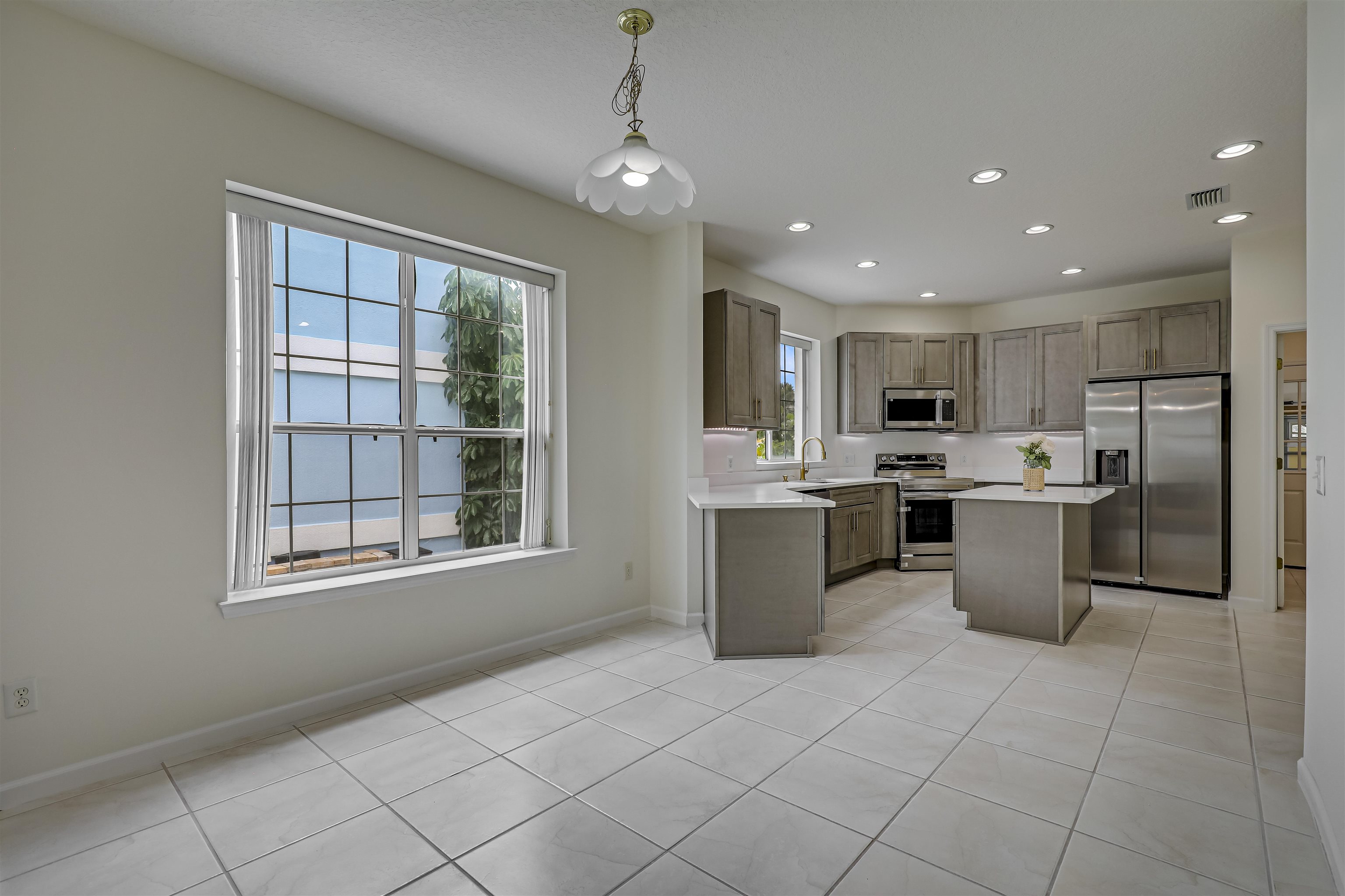 9162 August Circle St. Augustine, FL 32080 - Photo 29 of 81 a large kitchen with a large counter top appliances and cabinets