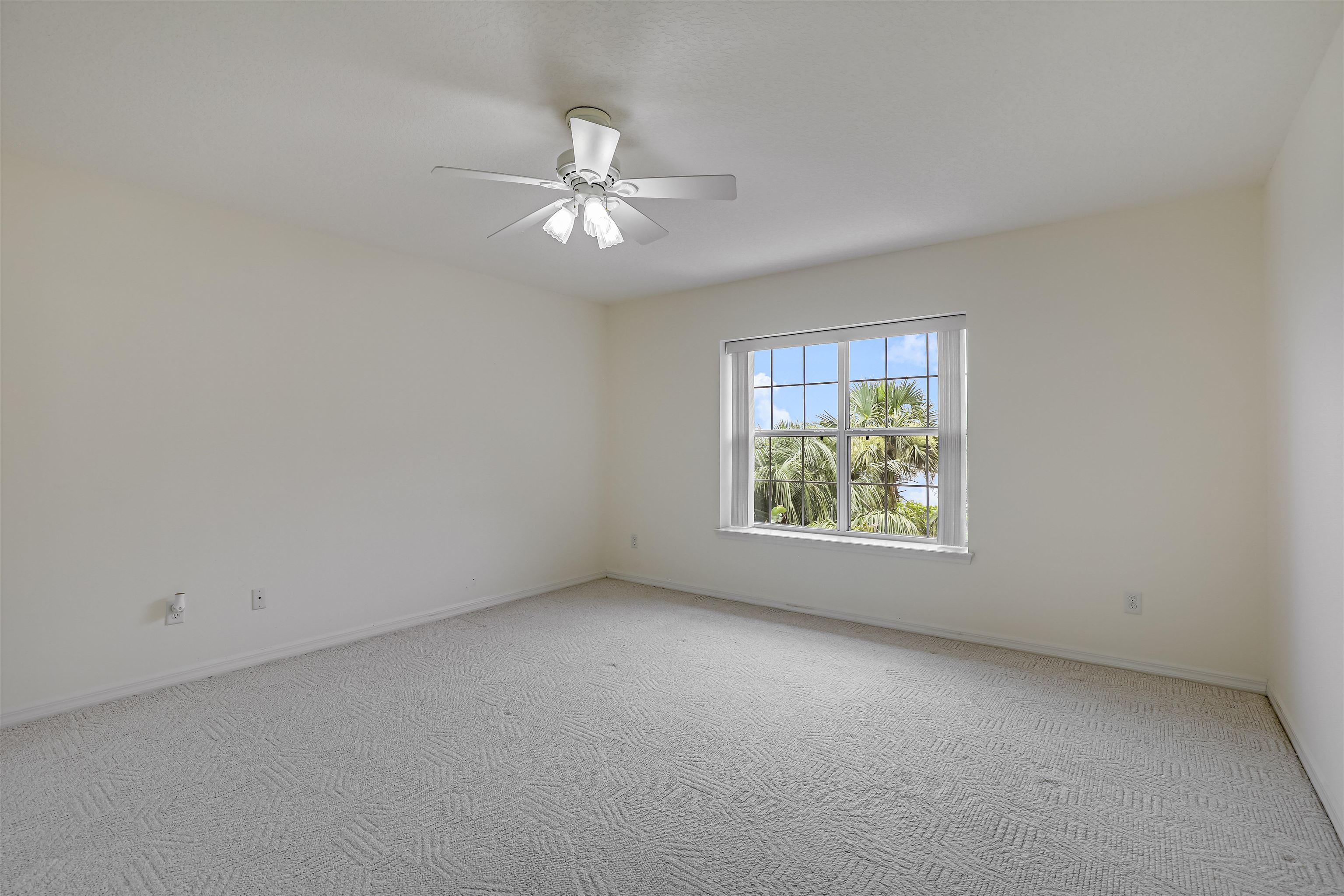 9162 August Circle St. Augustine, FL 32080 - Photo 33 of 81 an empty room with windows and fan