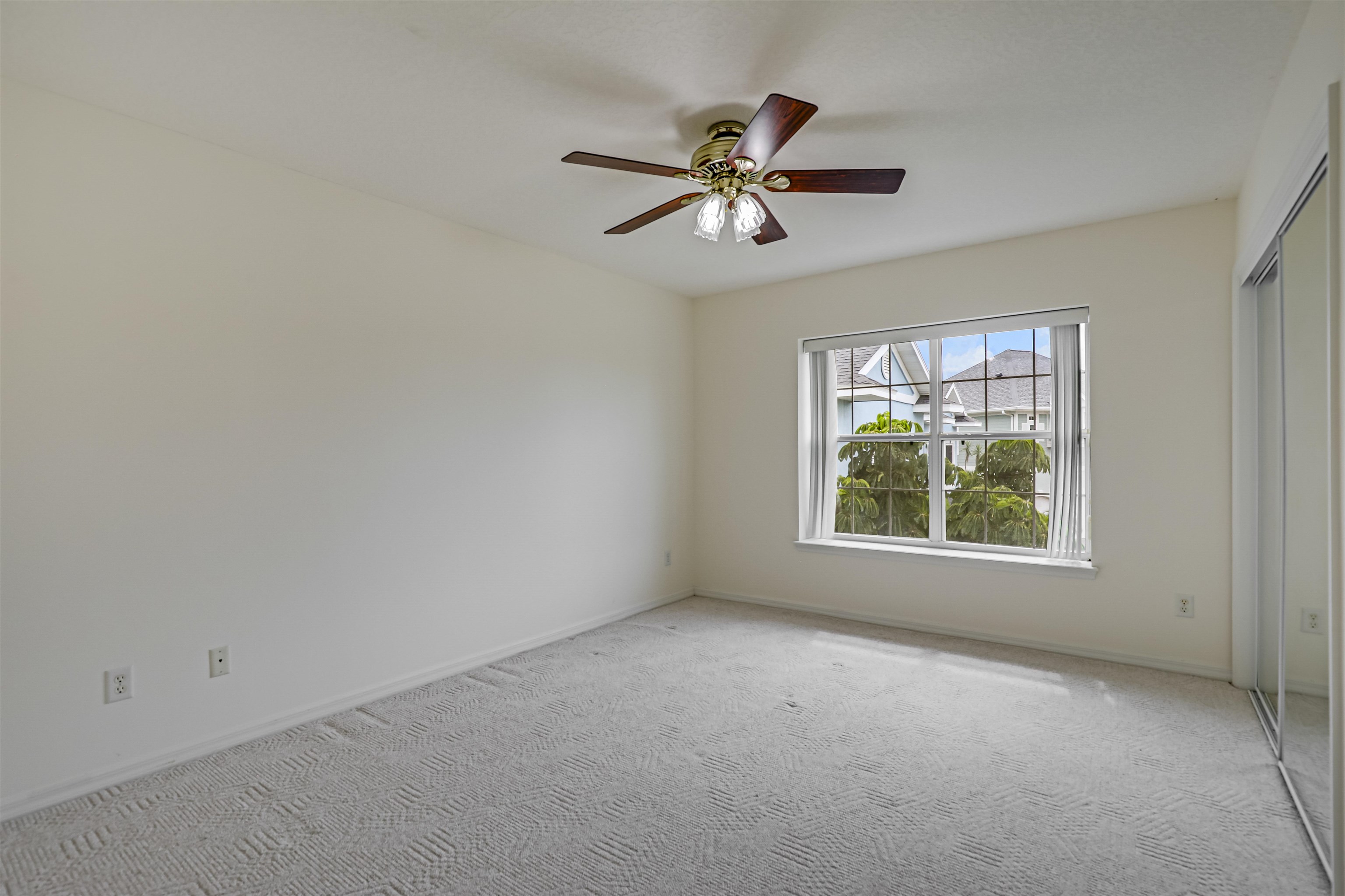 9162 August Circle St. Augustine, FL 32080 - Photo 47 of 81 an empty room with windows and fan