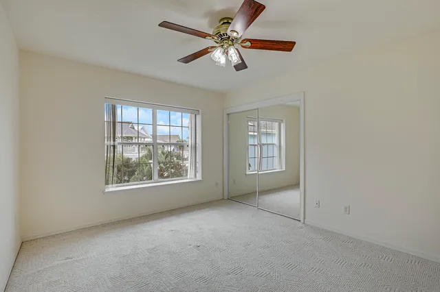an aerial view of residential building with outdoor space and ocean view