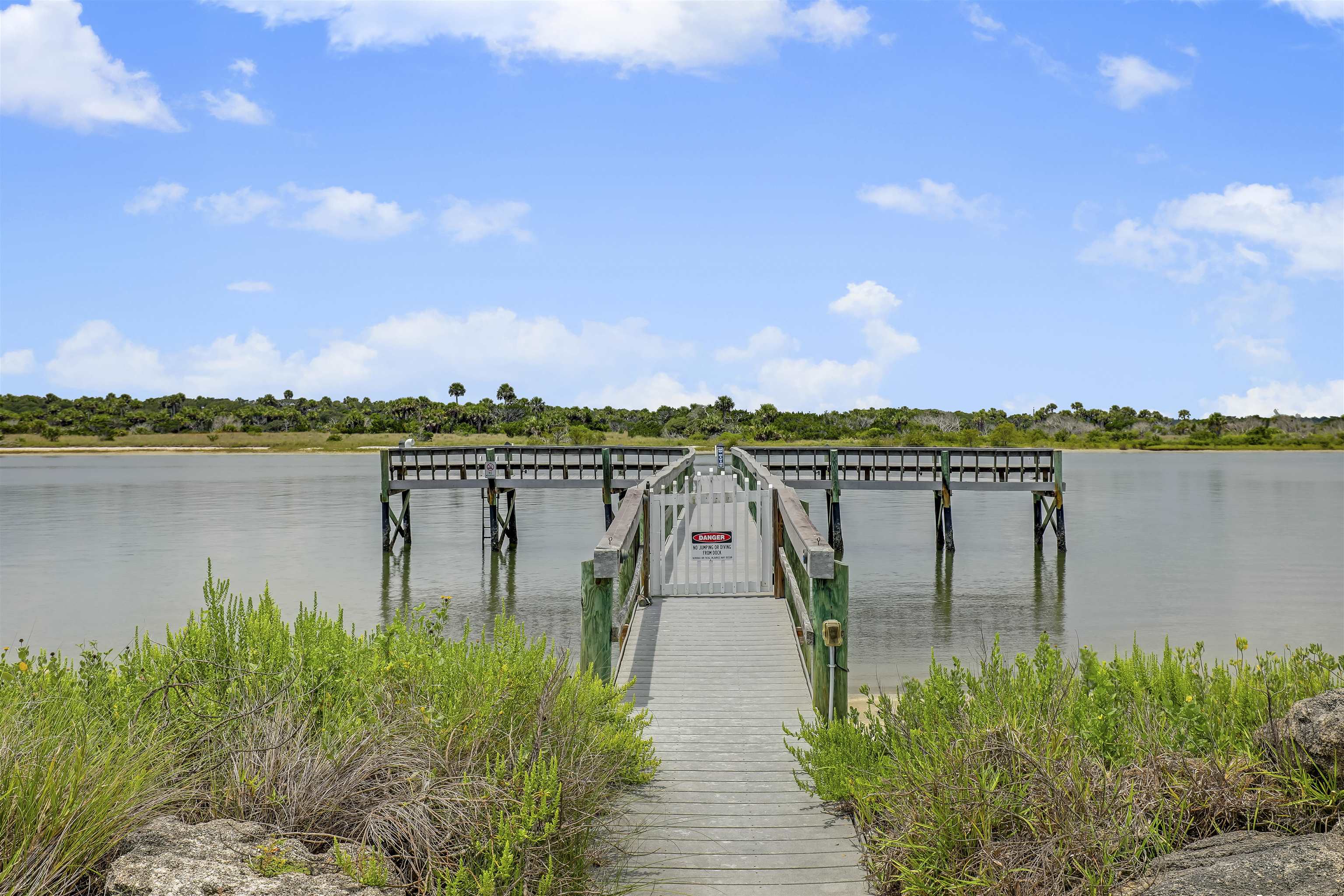 9162 August Circle St. Augustine, FL 32080 - Photo 5 of 81 a view of a lake with a large mountain in the background
