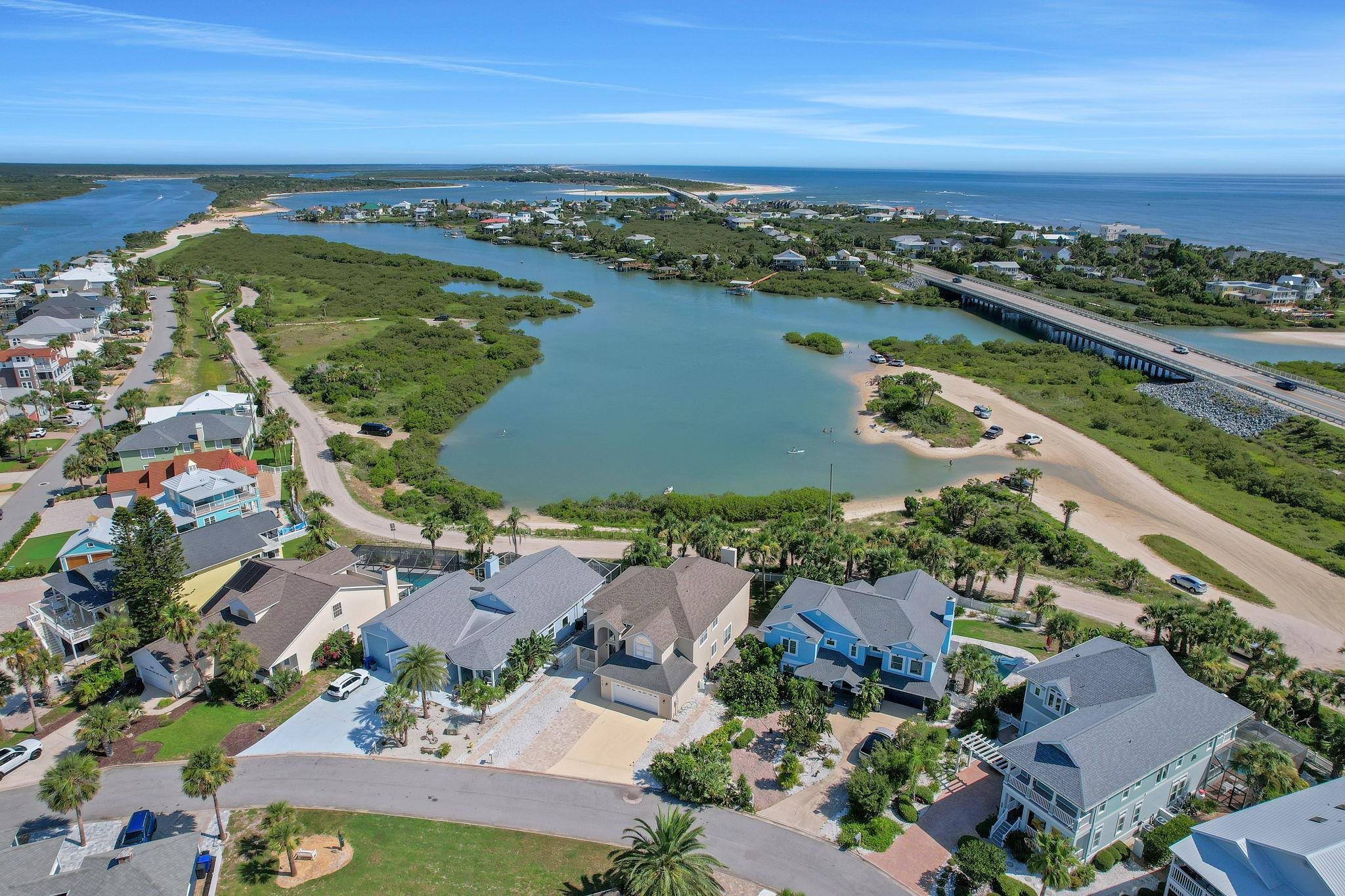 9162 August Circle St. Augustine, FL 32080 - Photo 76 of 81 Aerial perspective of suburban area featuring a notable bridge and a nearby body of water