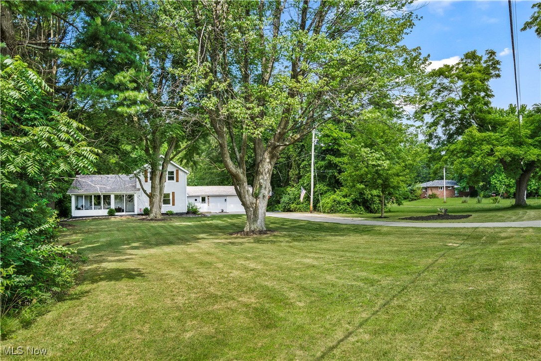 6170 Oberlin Road Amherst, OH 44001 - Photo 7 of 39 View of grassy yard with driveway