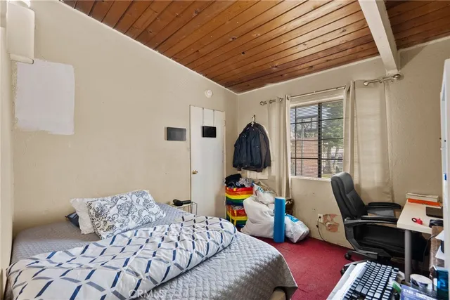 a bedroom with furniture and a window