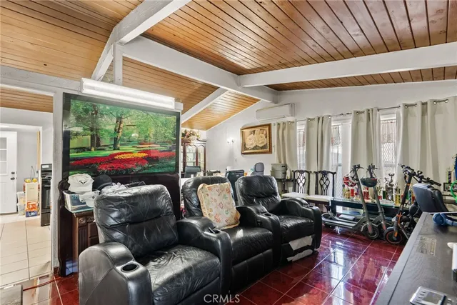 a projector room with furniture and a large window