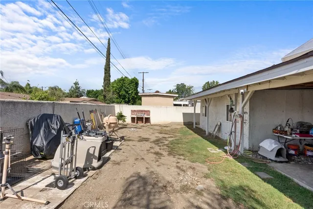 a view of a backyard with patio