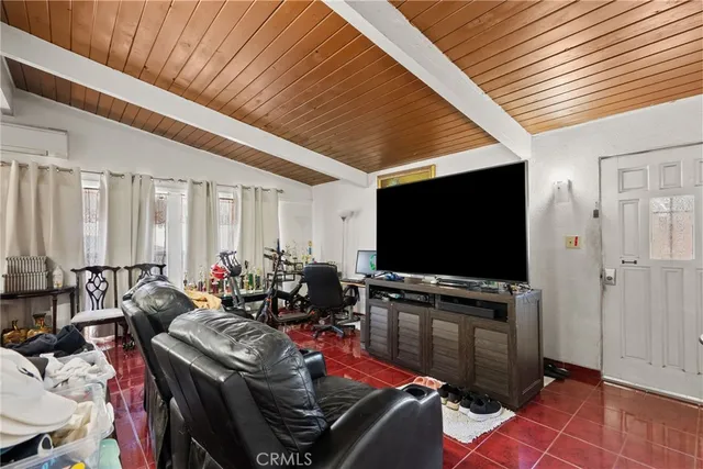 a room with furniture and flat screen tv