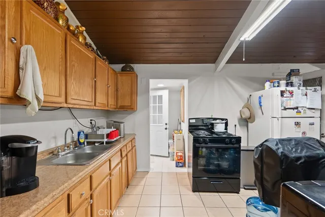 a kitchen with stainless steel appliances granite countertop a stove and a refrigerator