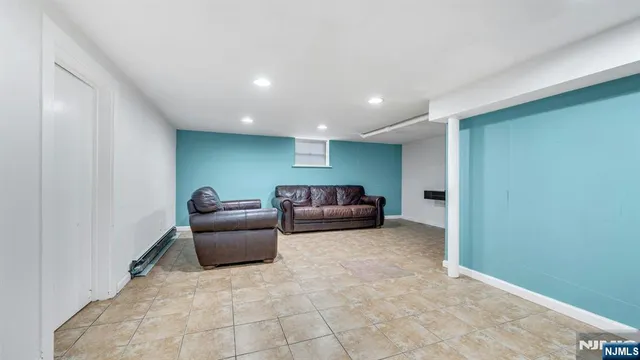 a bathroom with a sink mirror and toilet