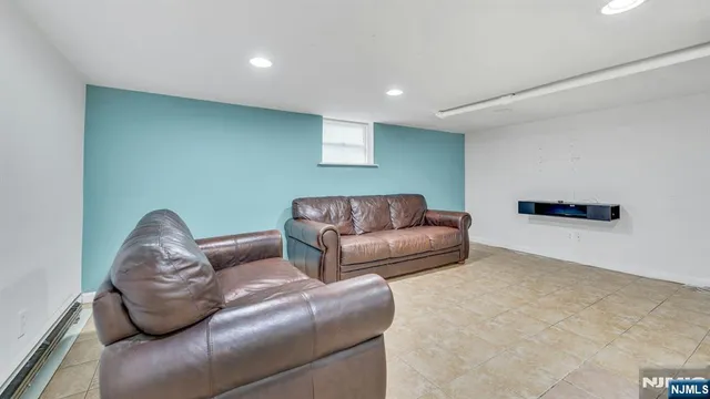 a view of an empty room with a kitchen