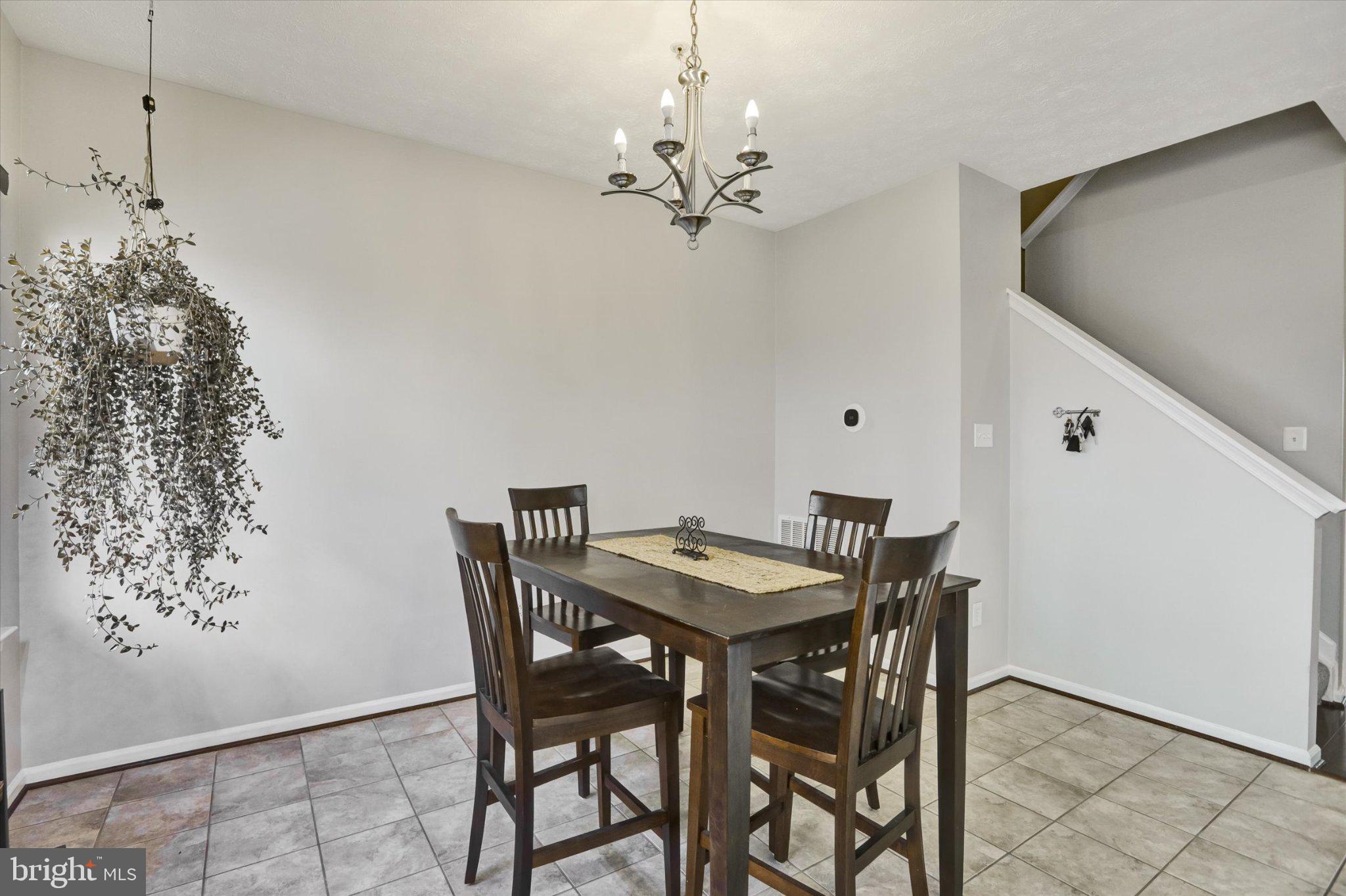 9663 Davison Road Middle River, MD 21220 - Photo 8 of 45 a view of a dining room with furniture and chandelier