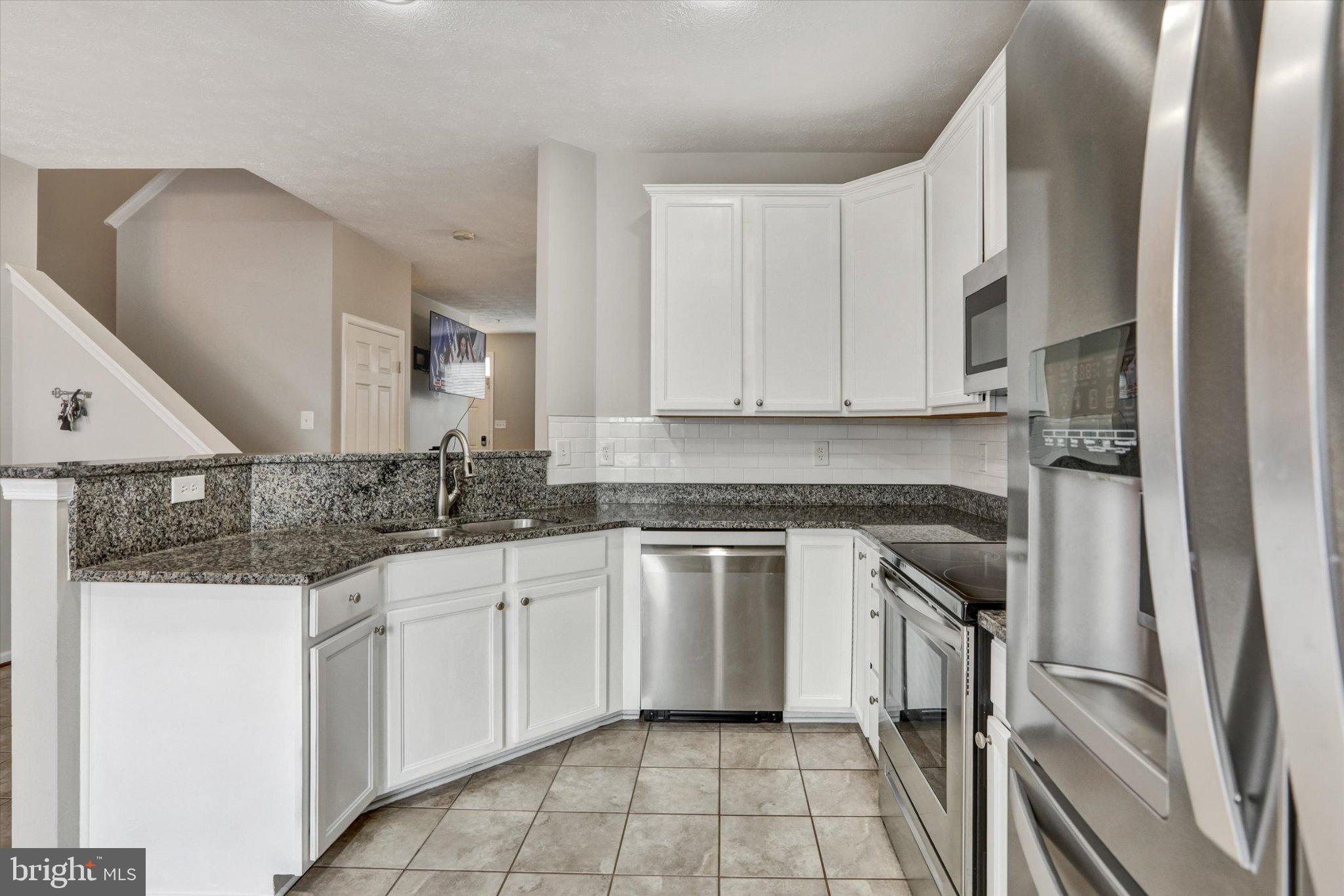 9663 Davison Road Middle River, MD 21220 - Photo 10 of 45 a kitchen with white cabinets appliances and a sink