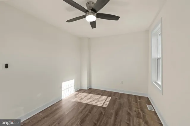 a view of wooden floor in an empty room