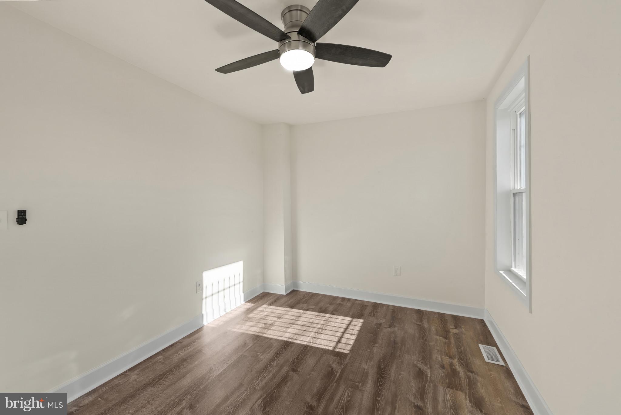 2419 Baker Street Baltimore, MD 21216 - Photo 19 of 40 a view of wooden floor in an empty room