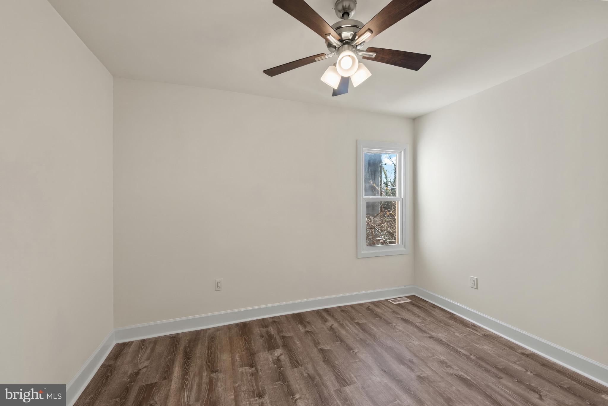 2419 Baker Street Baltimore, MD 21216 - Photo 22 of 40 an empty room with a window
