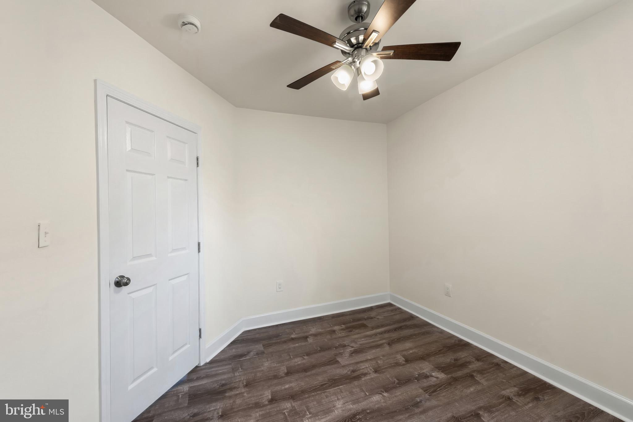 2419 Baker Street Baltimore, MD 21216 - Photo 23 of 40 wooden floor in an empty room