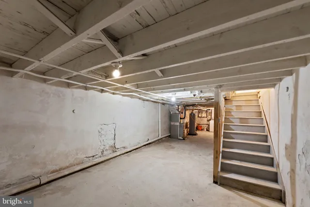 a view of room with stairs and a ceiling fan