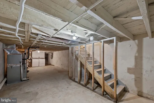 a view of an empty room with stairs