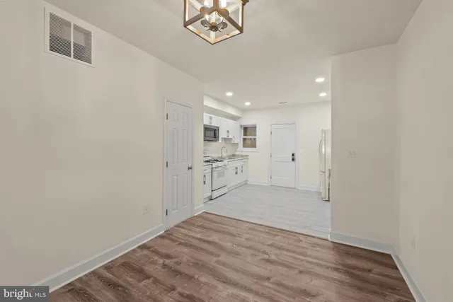 a view of a kitchen with a sink and a window