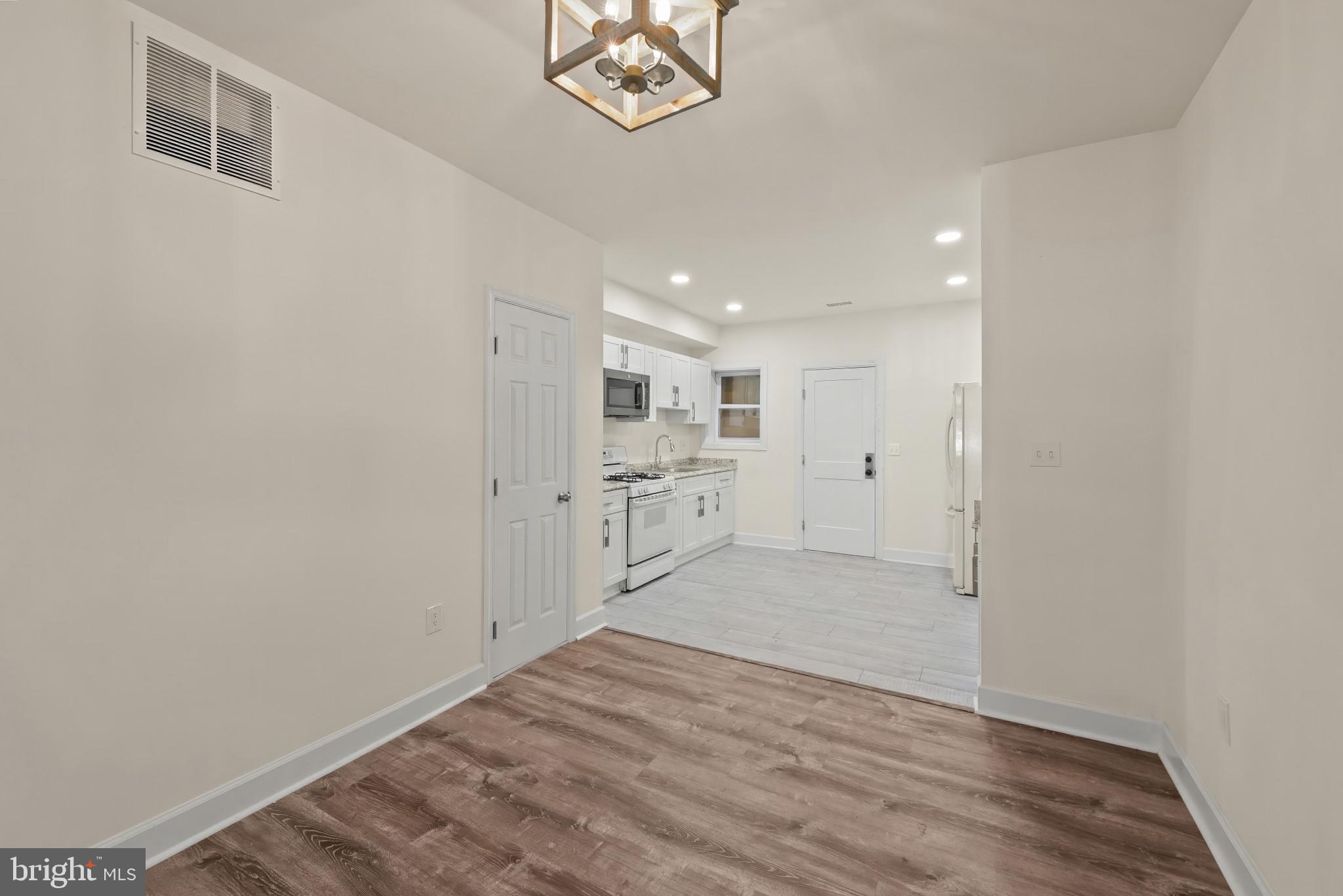 2419 Baker Street Baltimore, MD 21216 - Photo 8 of 40 a view of a kitchen with a sink and a window