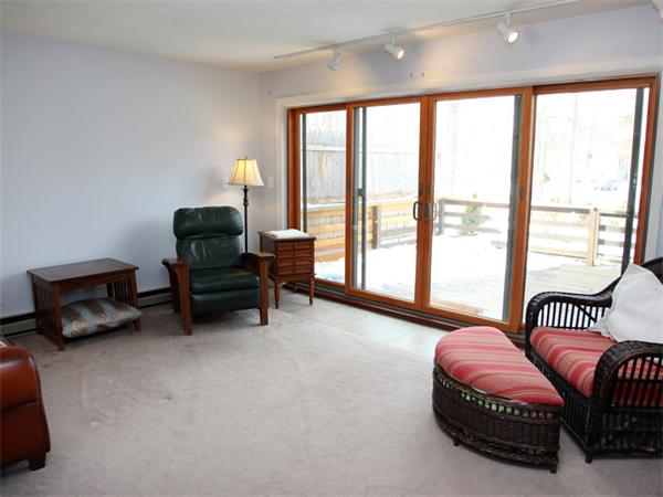 16 Round House Road, Unit 16 Bourne, MA 02532 - Photo 3 of 11 a bedroom with furniture and a large window