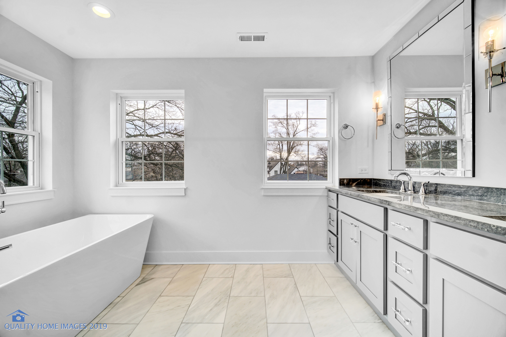 215 North Summit Street Wheaton, IL 60187 - Photo 20 of 36 a large bathroom with a tub sink and mirror
