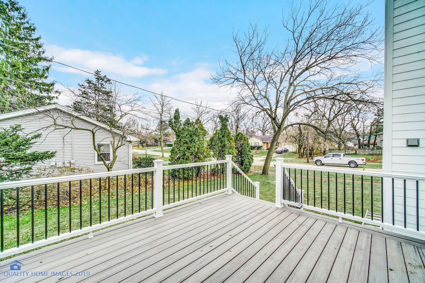 215 North Summit Street Wheaton, IL 60187 - Photo 32 of 36 a view of a house with a wooden deck