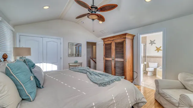 a bedroom with a bed couch and window