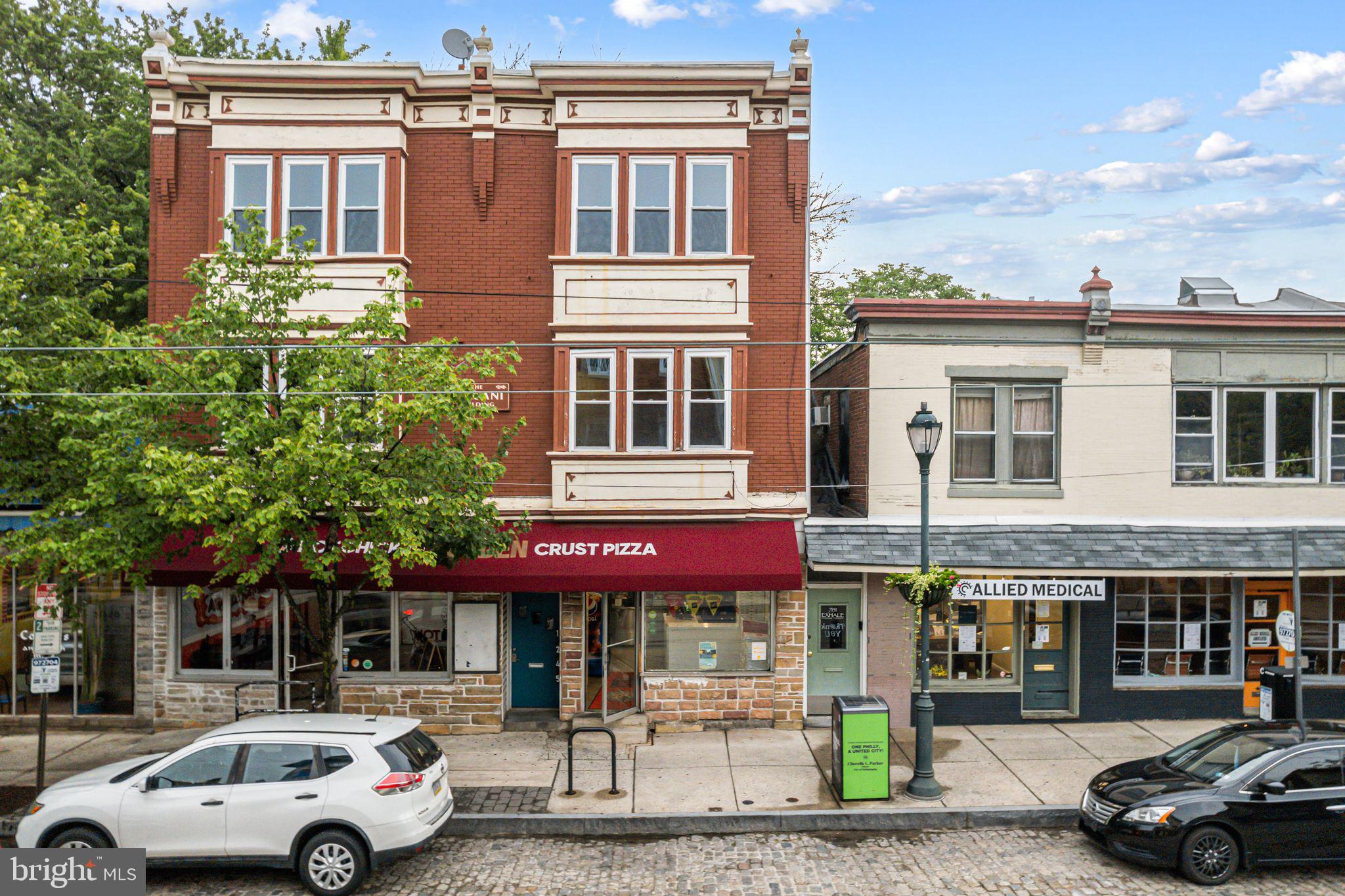 7153 Germantown Avenue, Unit 5 Philadelphia, PA 19119 - Photo 2 of 7 a front view of a building with parking space