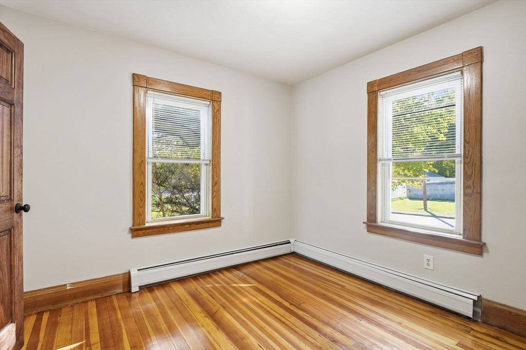 114 Connecticut Avenue West Springfield, MA 01089 - Photo 18 of 30 a view of an empty room with wooden floor and a window