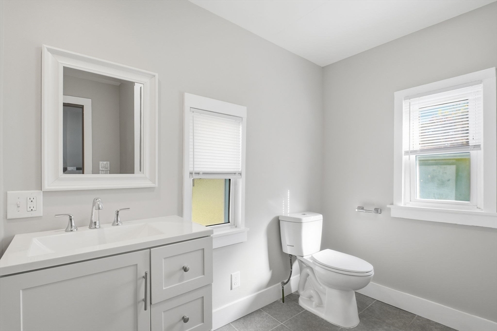 114 Connecticut Avenue West Springfield, MA 01089 - Photo 19 of 30 a bathroom with a toilet sink and mirror