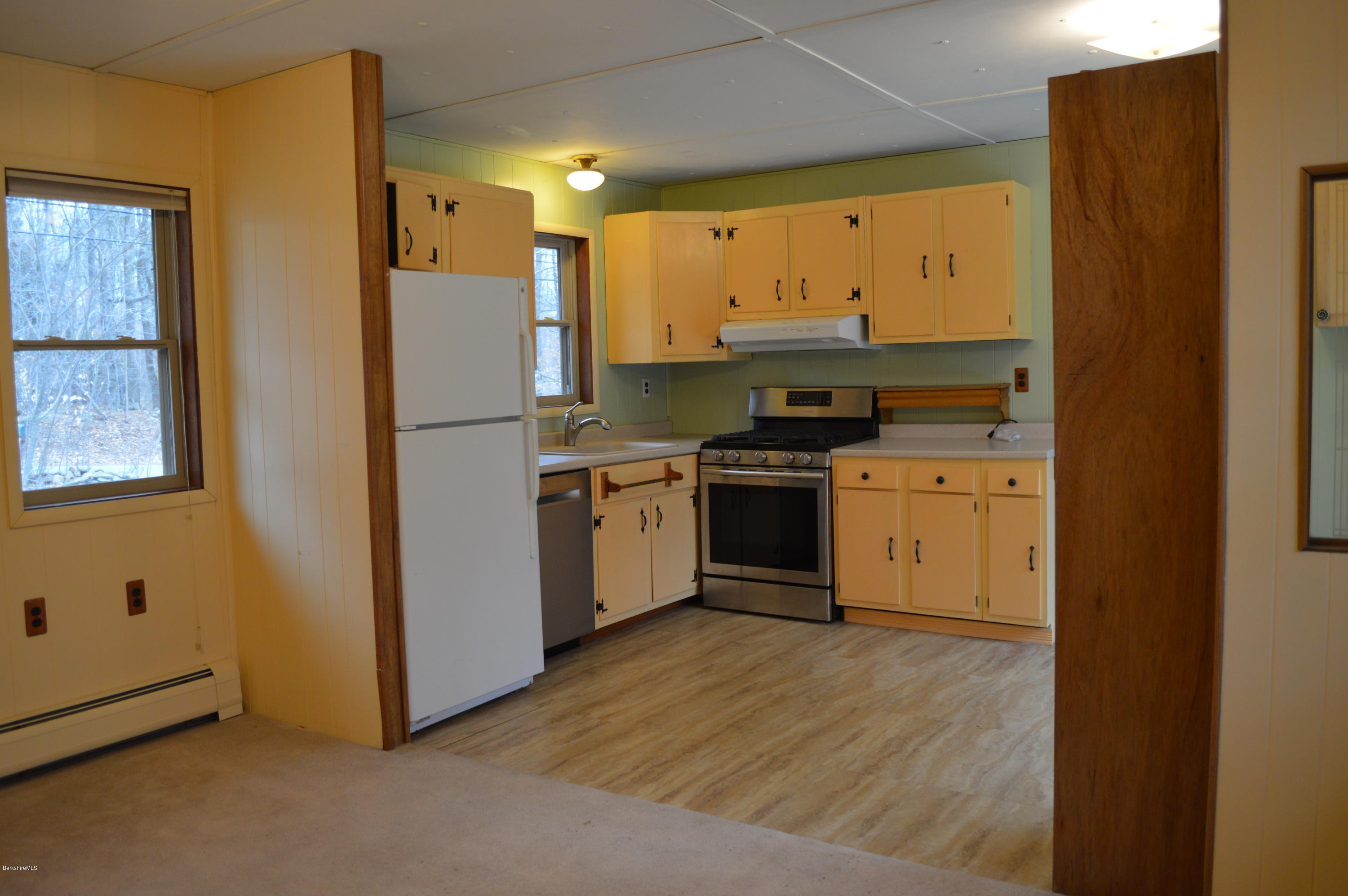 98 Wade Inn Road Becket, MA 01223 - Photo 6 of 30 a kitchen with a stove a sink and a refrigerator