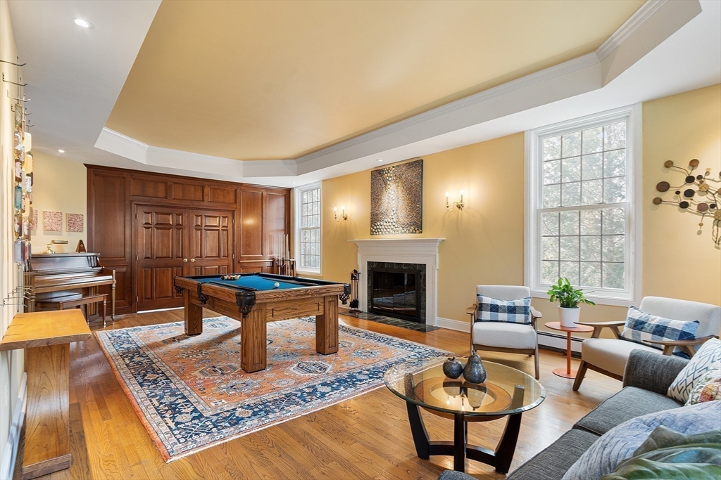 336 Lexington Road Concord, MA 01742 - Photo 15 of 41 a living room with furniture and a fireplace
