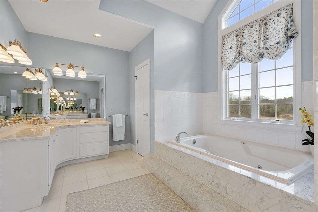 336 Lexington Road Concord, MA 01742 - Photo 26 of 41 a bathroom with a bathtub and a sink