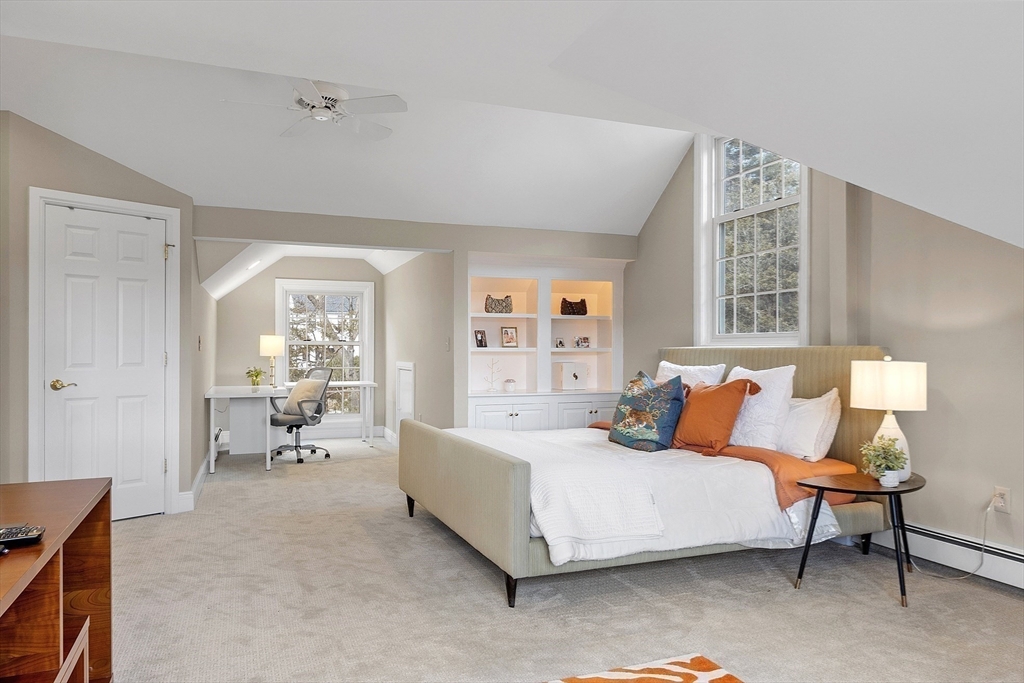 336 Lexington Road Concord, MA 01742 - Photo 27 of 41 a bedroom with furniture and a large window