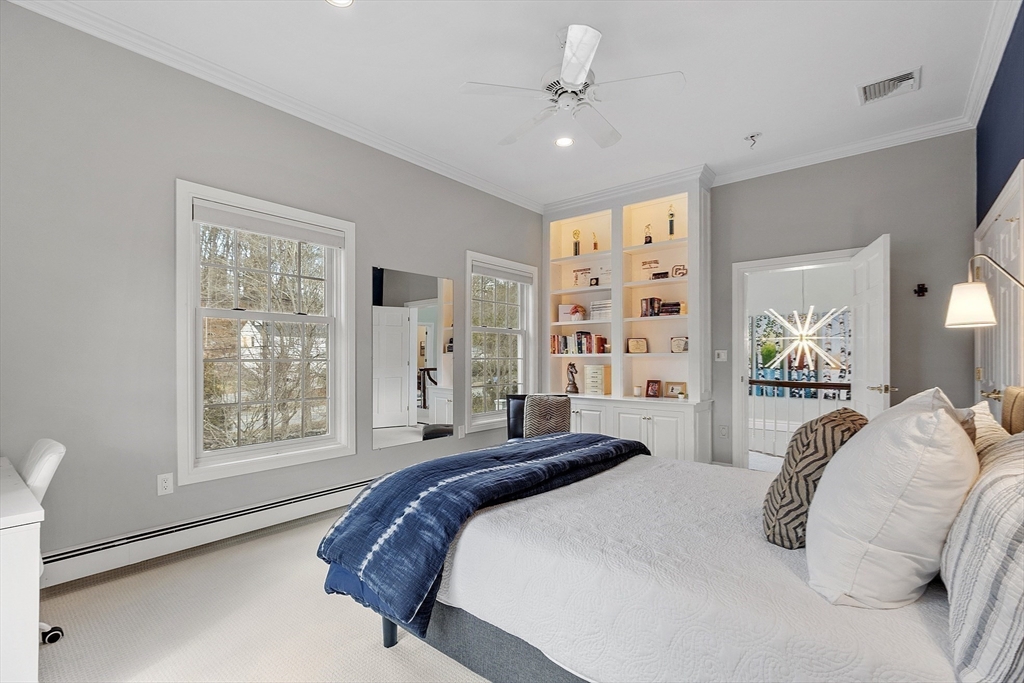336 Lexington Road Concord, MA 01742 - Photo 29 of 41 a spacious bedroom with a large bed and a window