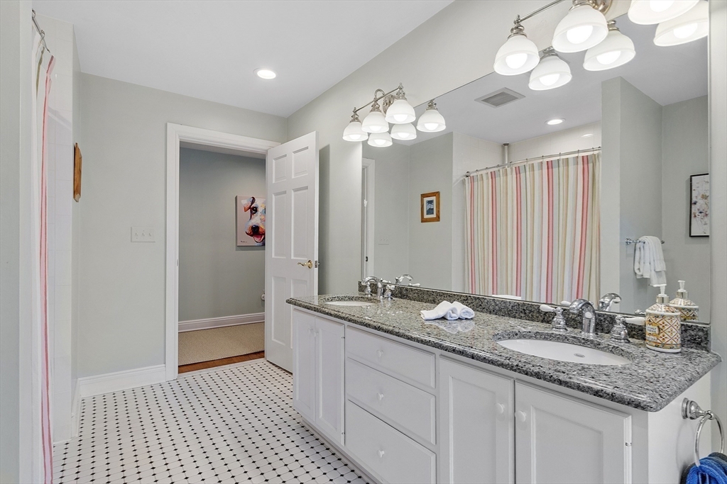 336 Lexington Road Concord, MA 01742 - Photo 31 of 41 a bathroom with a sink double vanity and a shower