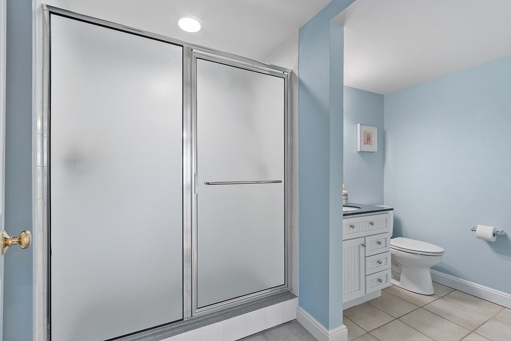 336 Lexington Road Concord, MA 01742 - Photo 39 of 41 a bathroom with a shower and a toilet