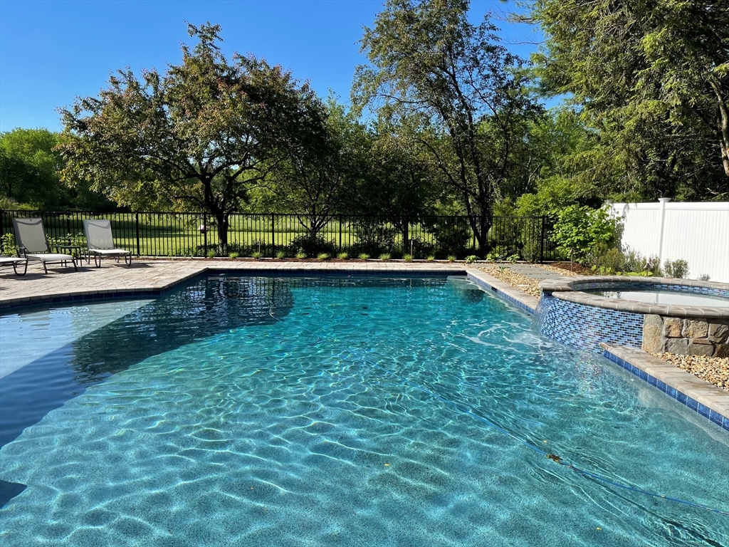 336 Lexington Road Concord, MA 01742 - Photo 6 of 41 a view of backyard with swimming pool and seating space