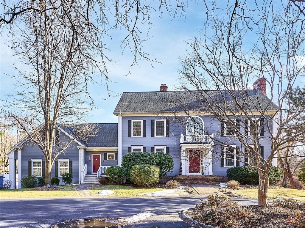 336 Lexington Road Concord, MA 01742 - Photo 7 of 41 a front view of a house with a yard