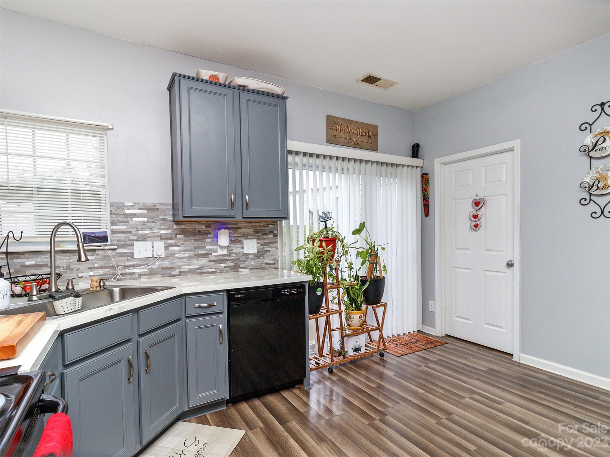3053 Summerfield Ridge Lane Matthews, NC 28105 - Photo 19 of 37 a kitchen with stainless steel appliances granite countertop a refrigerator and a sink