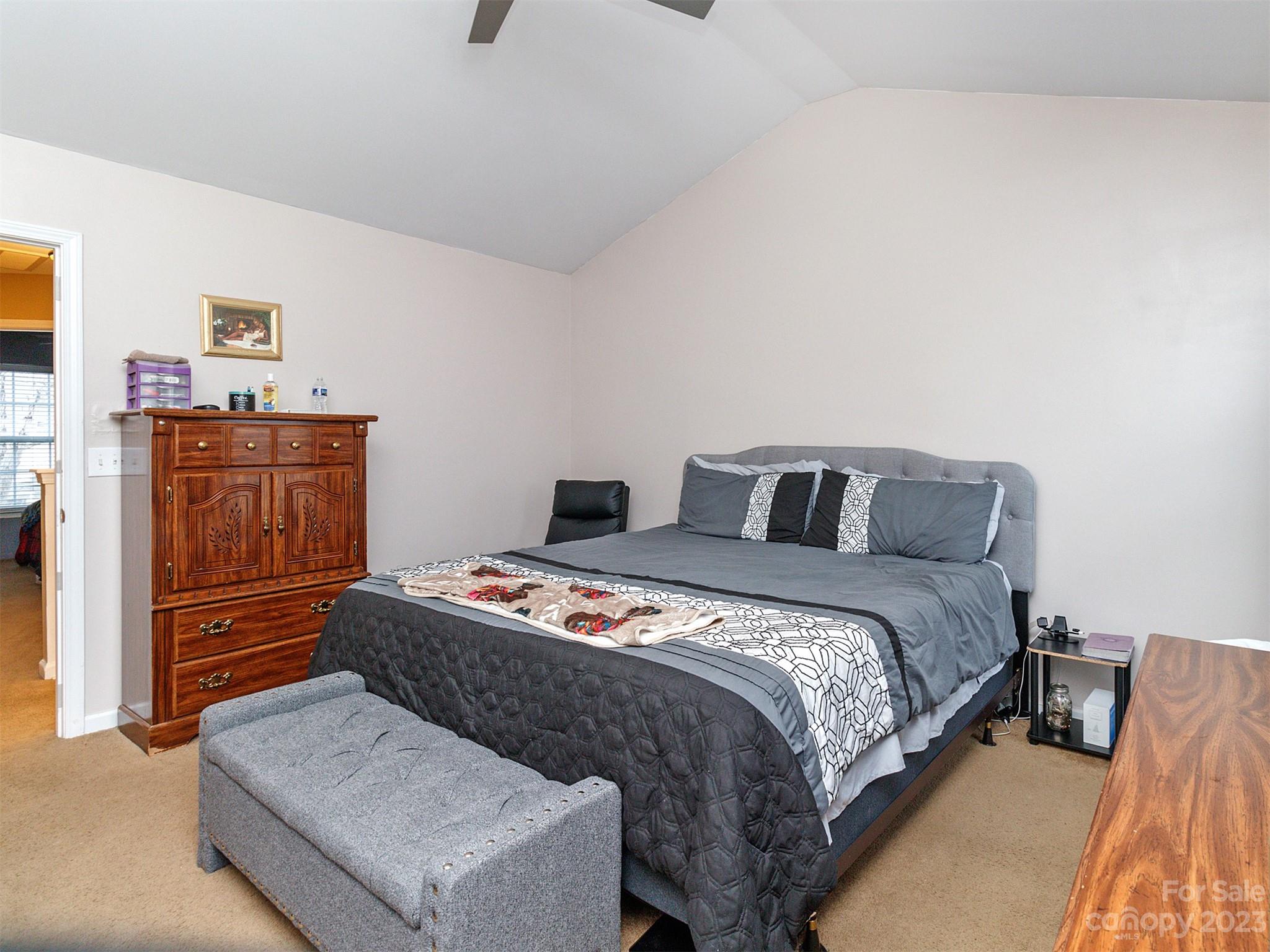 3053 Summerfield Ridge Lane Matthews, NC 28105 - Photo 23 of 37 a bedroom with a bed and dresser