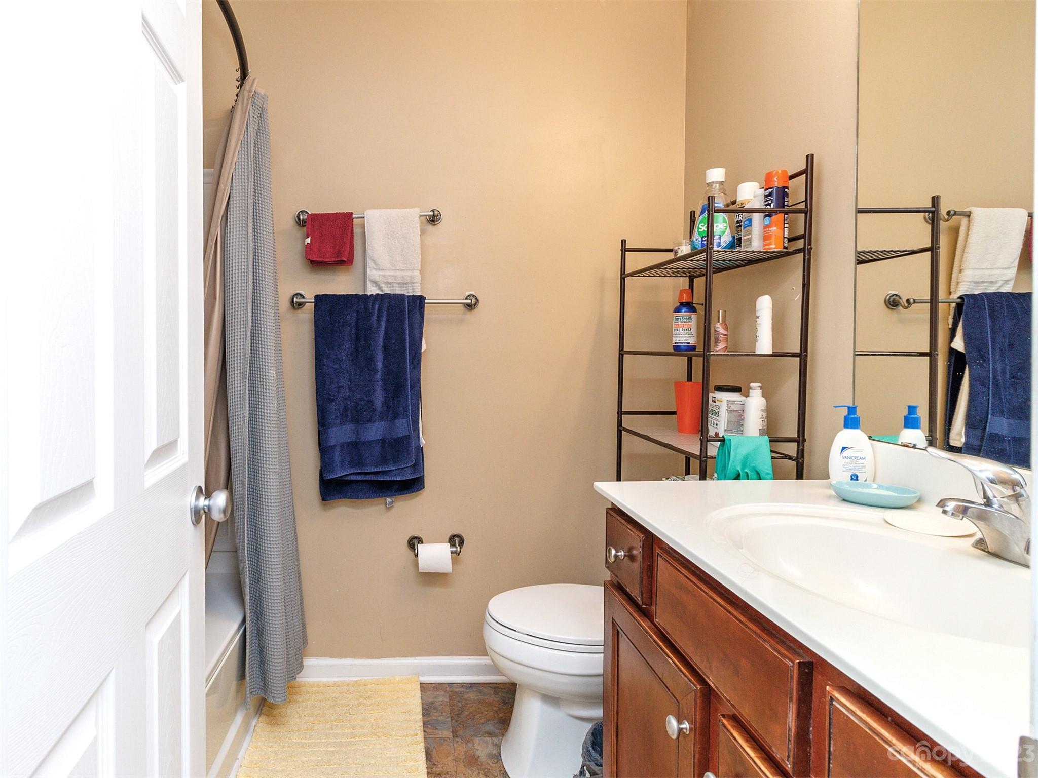 3053 Summerfield Ridge Lane Matthews, NC 28105 - Photo 26 of 37 a bathroom with a sink vanity mirror and toilet