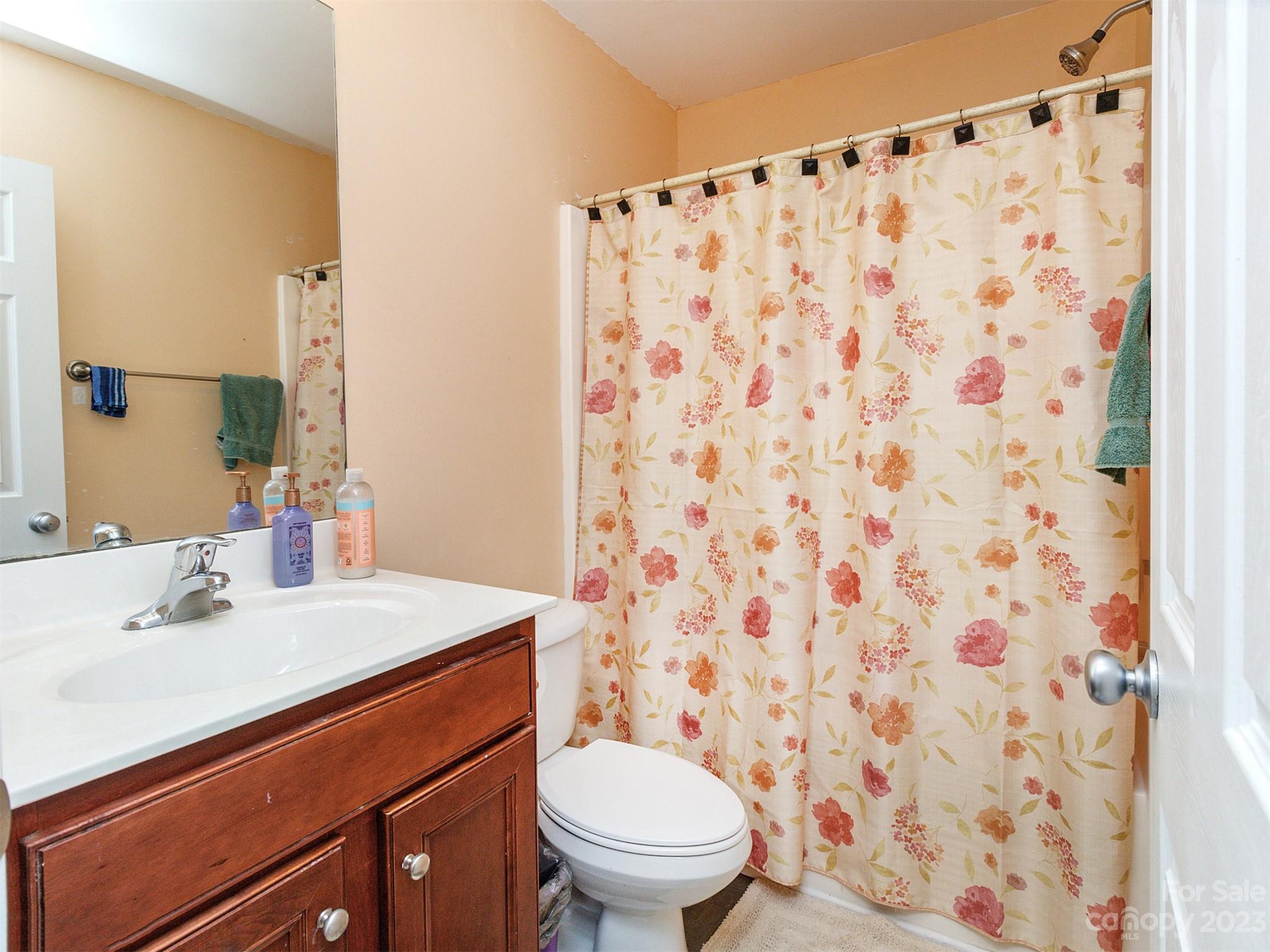 3053 Summerfield Ridge Lane Matthews, NC 28105 - Photo 30 of 37 a bathroom with a sink toilet and shower