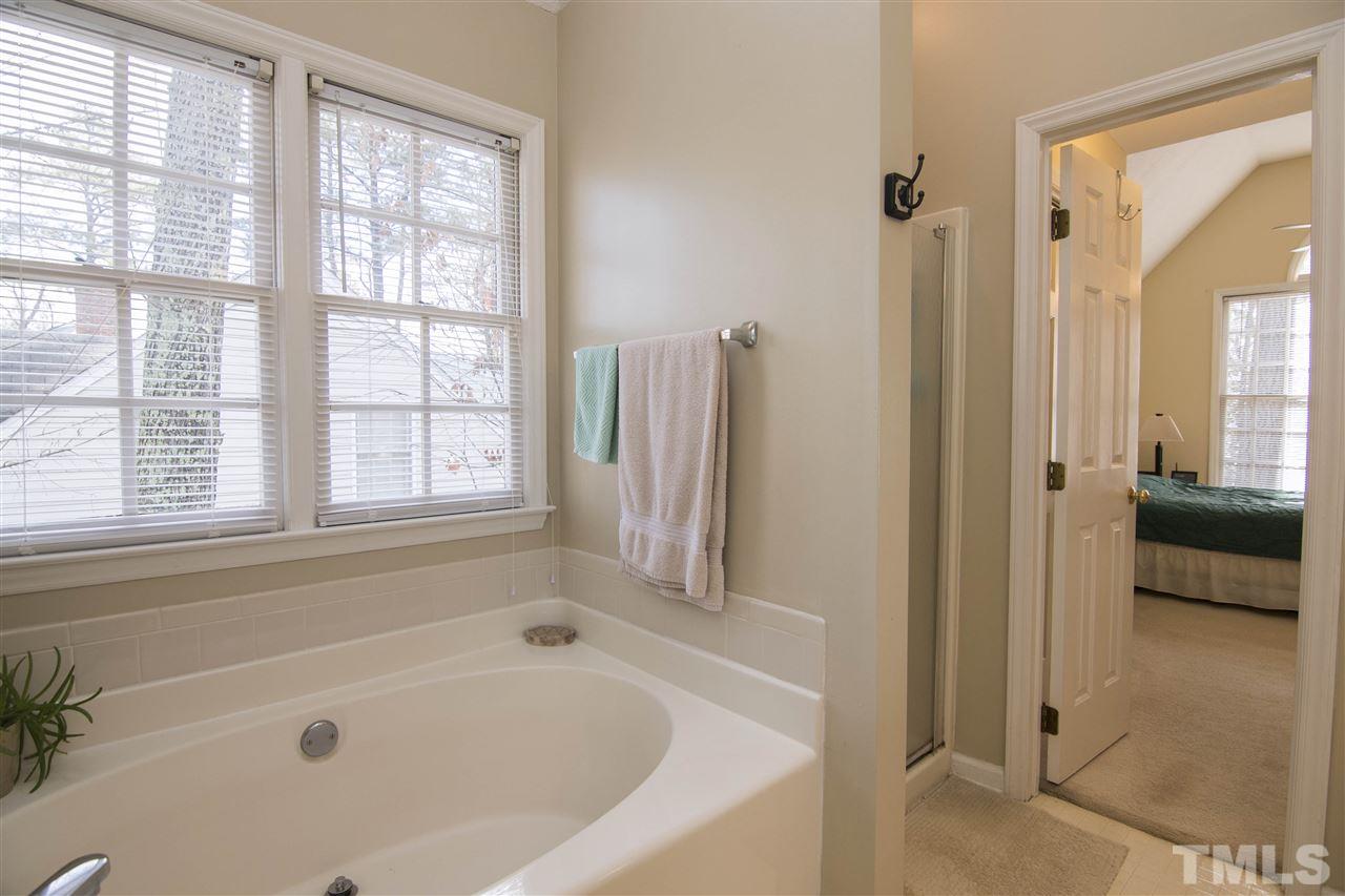 4416 Emmit Drive Raleigh, NC 27604 - Photo 15 of 28 a white bath tub sitting next to a window