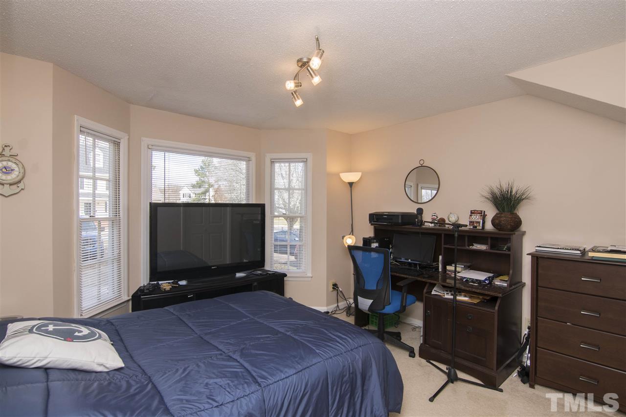 4416 Emmit Drive Raleigh, NC 27604 - Photo 16 of 28 a living room with furniture and a flat screen tv
