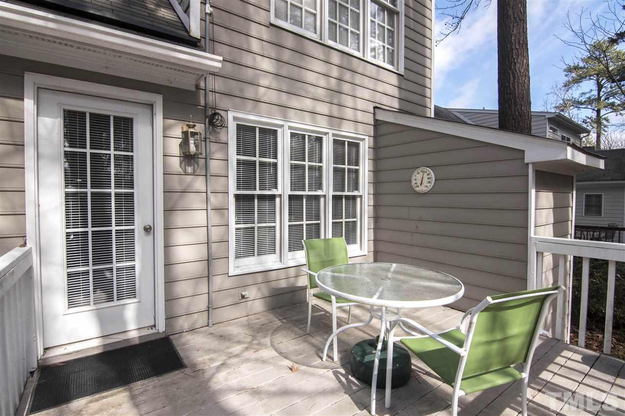 4416 Emmit Drive Raleigh, NC 27604 - Photo 19 of 28 a backyard of a house with table and chairs