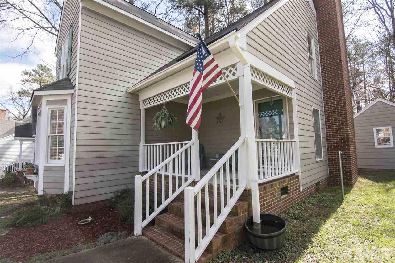 4416 Emmit Drive Raleigh, NC 27604 - Photo 3 of 28 a view of a house with wooden fence and two windows